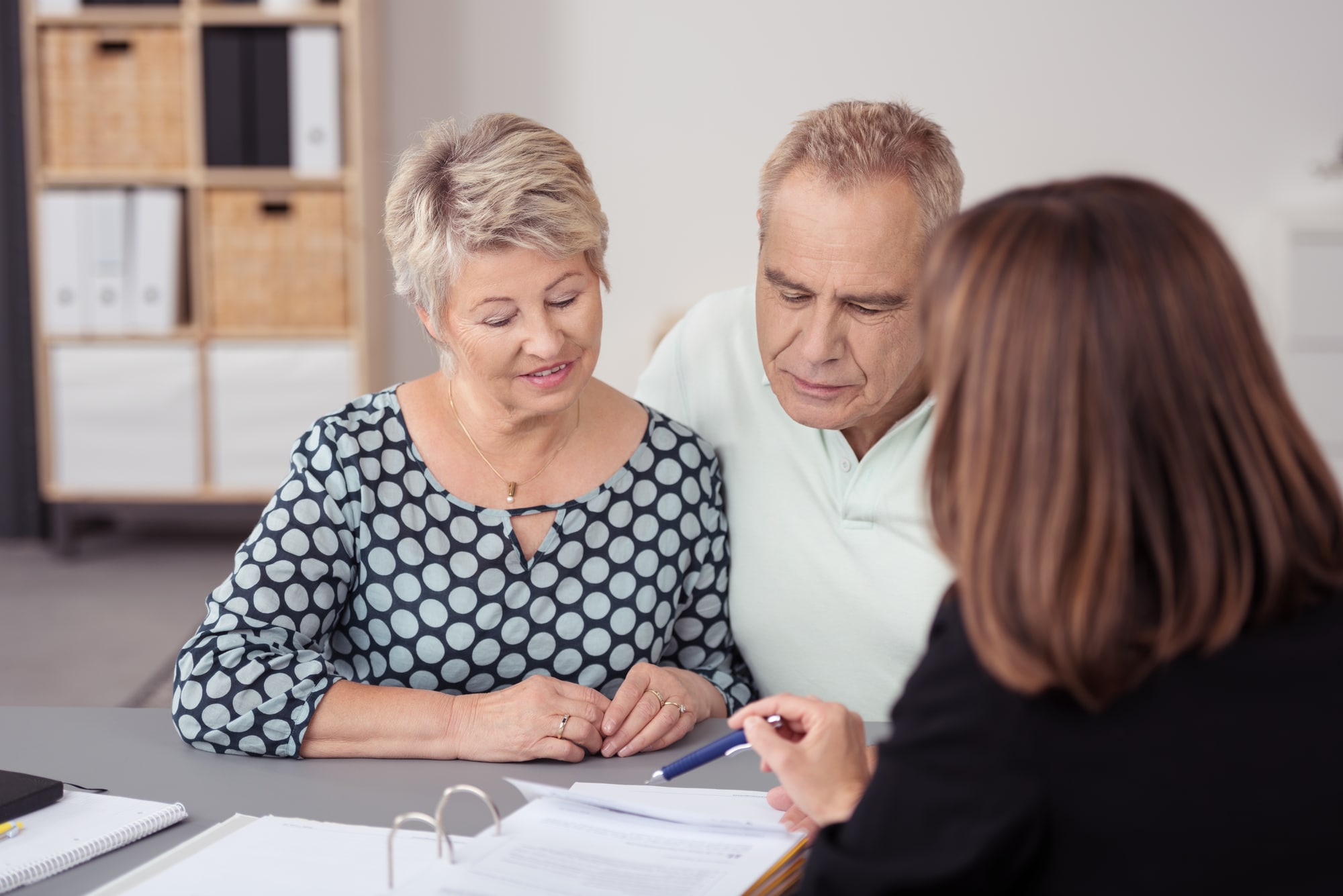 Senior Couple Listening to Business Agent Talking
